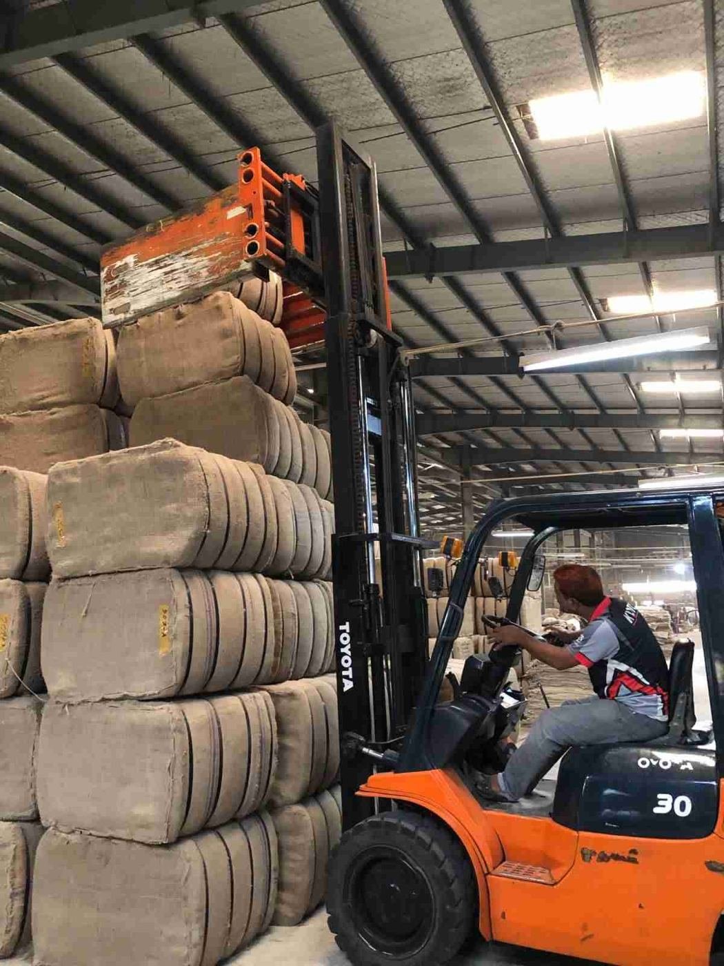Forklift loading jute bales