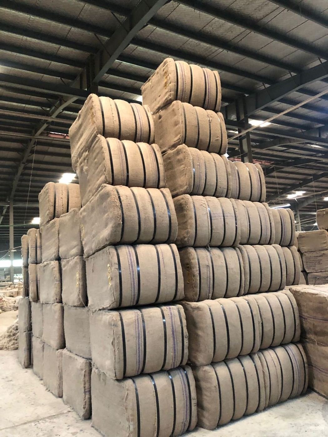 Stacked jute bales in a warehouse